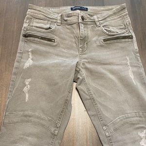 ripped light washed green high rise skinny jeans